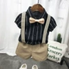 Black shirt, trousers, bow tie, suspenders