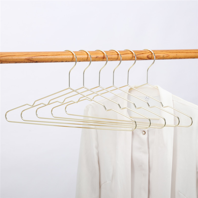 Estilo nórdico percha de ropa de metal antideslizante sin costuras percha de ropa de nueve hoyos galvanoplastia percha de ropa para el hogar percha de ropa de triángulo de oro rosa