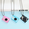 Small camera, necklace, keychain, purse, phone case, accessory, pendant, makes sounds