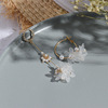 Asymmetrical earrings from pearl, silver needle with tassels, flowered, bright catchy style, silver 925 sample