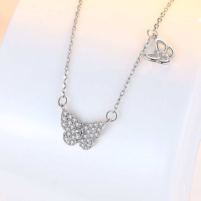 Celebridad en línea Singapur S925 mariposa Collar de plata colgante nicho diseño simple hueco clavícula cadena femenina fabricante