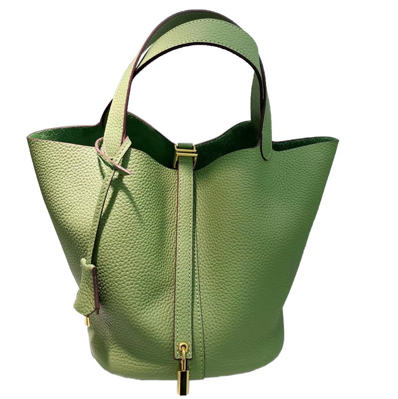 El nuevo bolso de cesta de verduras de marea de cuero togo de piel de vaca de capa superior 2025, bolso de cubo con cerradura de mano, bolso de cuero para mujer