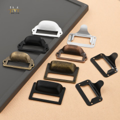 Antique bronze-colored labeled square old-fashioned grocery box cabinet drawer with a hinged label insert and label pull handle