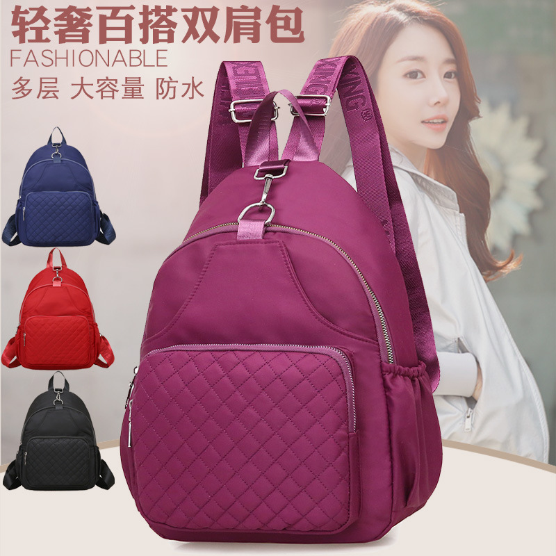 2021 nueva moda simple impermeable mochila de viaje de gran capacidad Mochila casual de nylon de tela Oxford para mujer