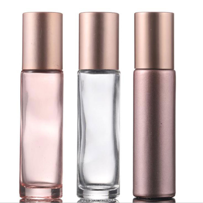 Golden rollerball bottle for essential oils contains rose