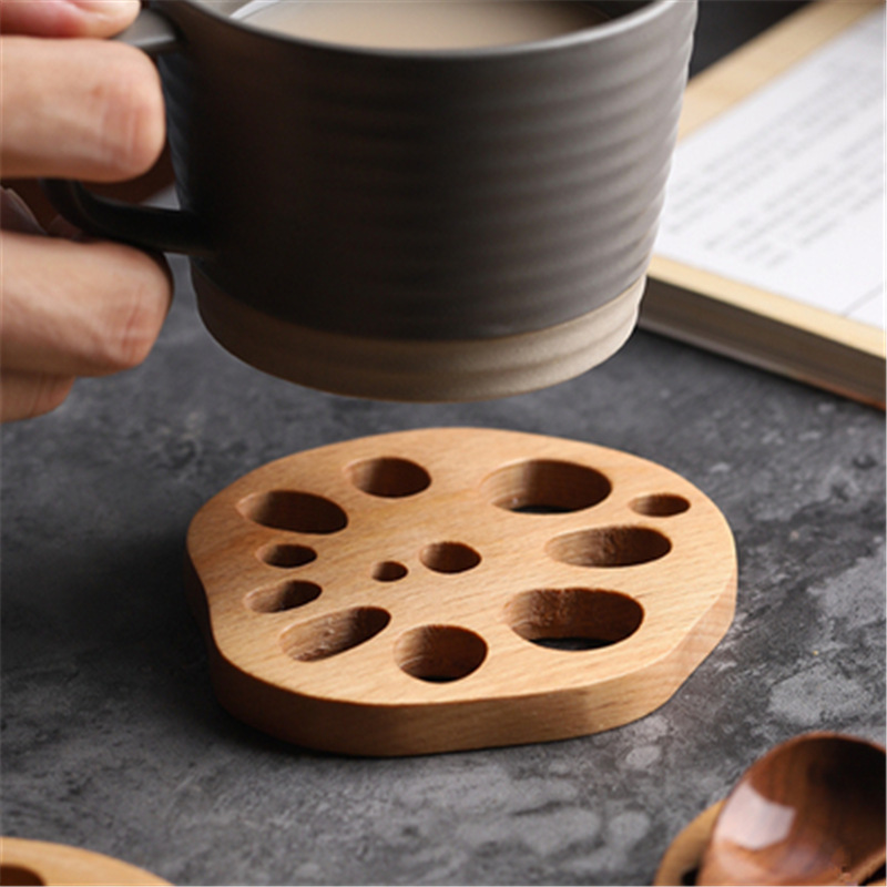 En stock creativo taza estera de madera de aislamiento de kung fu taza de té titular de la raíz de loto de haya pieza de montaña estufa hirviendo taza de té estera