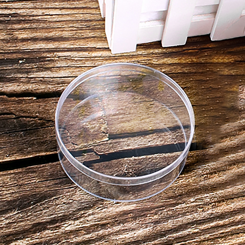 Fábrica al por mayor 120ml caja de plástico redonda de grado alimenticio transparente sellado cristal barro embalaje pequeña caja redonda con tapa