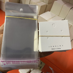 KP204 About 100 pieces of 5.5*5.5 four-hole earring paper cards and about 100 pieces of 7*14 transparent bags
