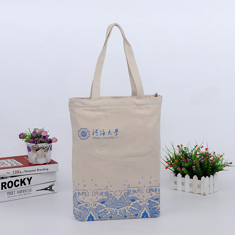Bolsas de algodón de regalo impresas al por mayor, bolsas de libros de lona portátiles de gran capacidad para la formación de estudiantes, al por mayor, personalizadas al por mayor