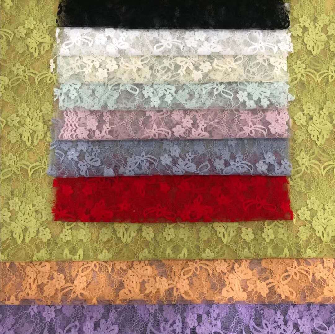 热销款弹力锦氨单丝蝴蝶小花有光三边波浪提花蕾丝 裙装面料 现货