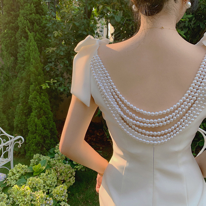 Design white evening dress with bow