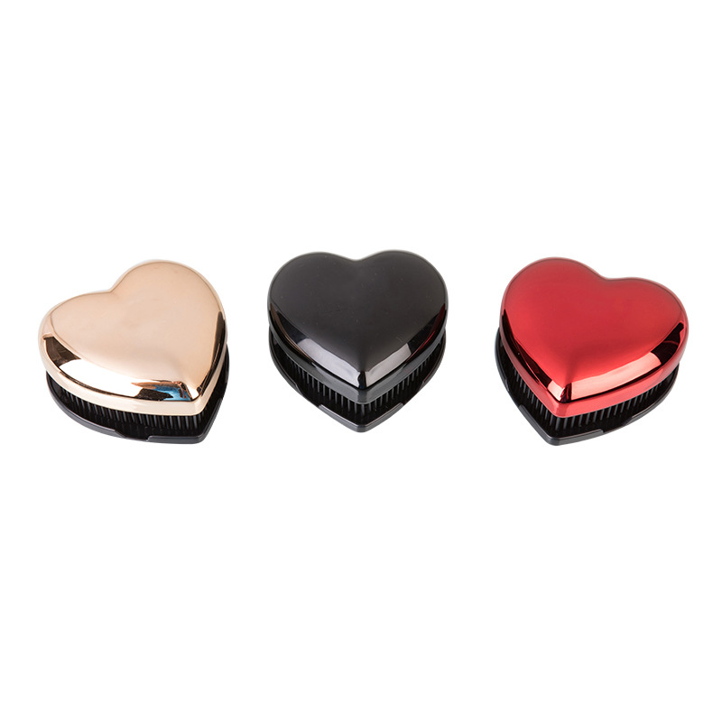 Fábrica al por mayor plástico peine Shunfa huevo peine creativo portátil cojín de aire masaje peine plástico peine en forma de corazón shunfa peine