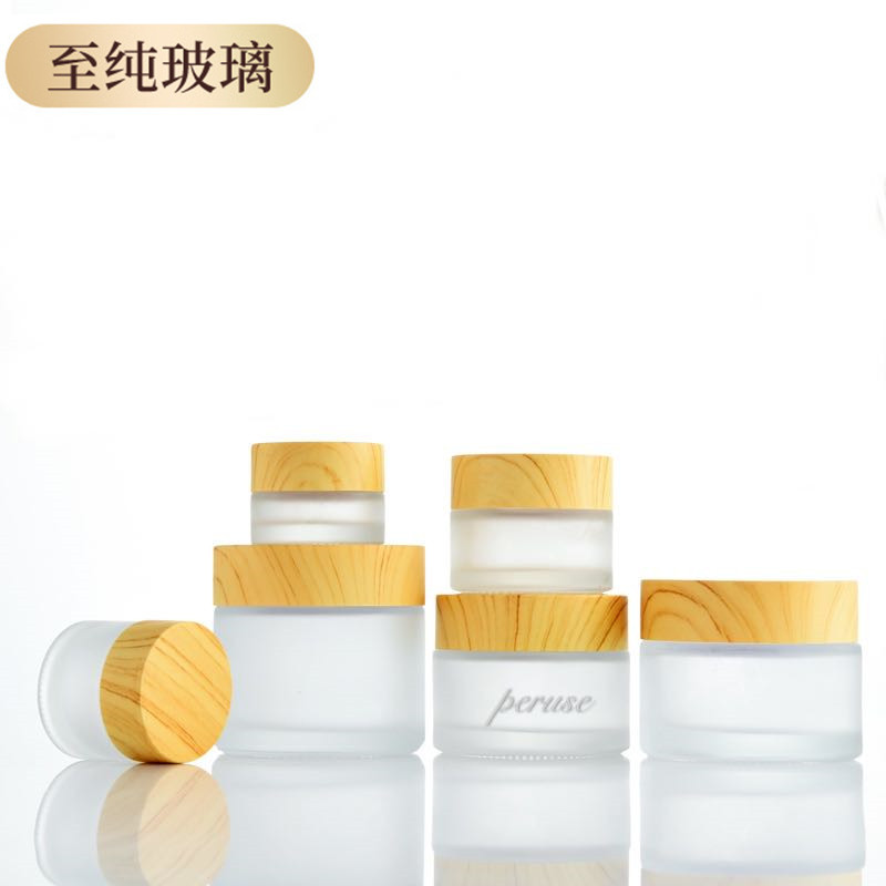 Venta al por mayor cubierta de grano de madera 50g botella de crema para los ojos botella de crema facial crema de vidrio esmerilado sub-botella de transferencia de agua muestra de impresión
