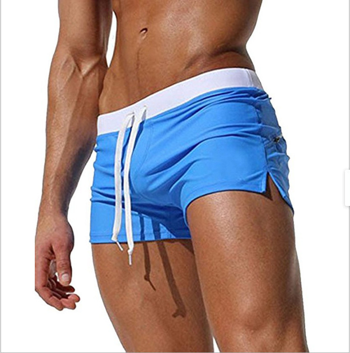 European and American men's solid color sexy fashion back pocket design beach breathable quick-drying pants flat angle beach pants swimming pants