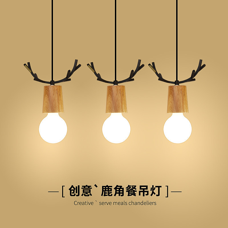 Nordic pequeña lámpara de araña comedor personalidad creativa de una sola cabeza macaron de madera asta simple moderna lámpara de sala de estar de tres cabezas