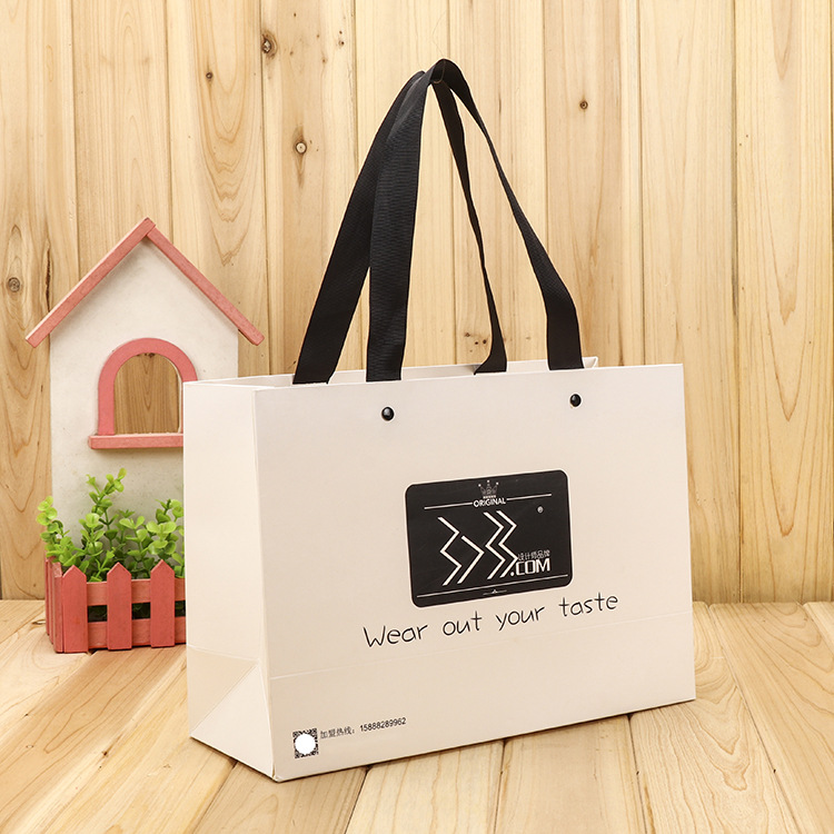 烫金服装纸袋高档压纹手提袋内嵌铆钉白卡礼品袋牛皮纸购物包装袋