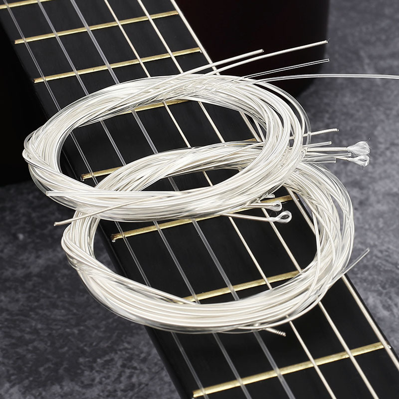 A granel guitarra clásica cuerdas de nylon fábrica al por mayor cadenas clásicas plateado fábrica cuerdas accesorios de guitarra