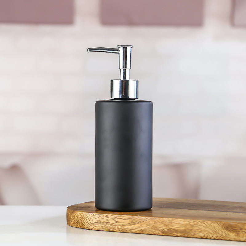 Descuentos de los fabricantes para rociar color cilíndrico con puntos de oro botella de vidrio desinfectante para manos gel de ducha champú embotellado