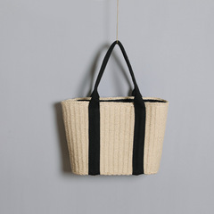 A wholesale supplier of one-piece shoulder bags, featuring 2024 new minimalist large-capacity grass-woven bags, Instagram retro fashionable style.