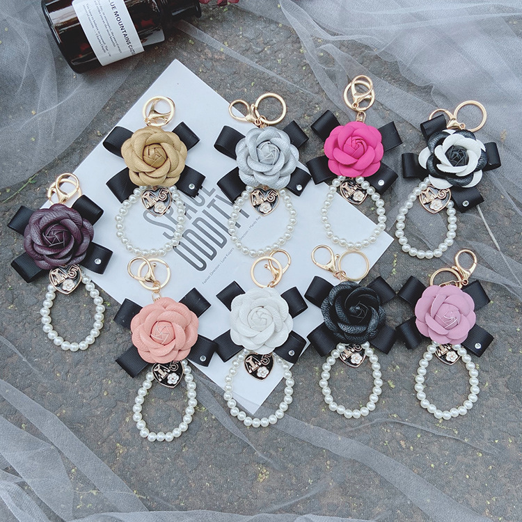 Moda nuevo arco Camelia llavero creativo perla cadena pu cuero Rosa colgante Accesorios image 6