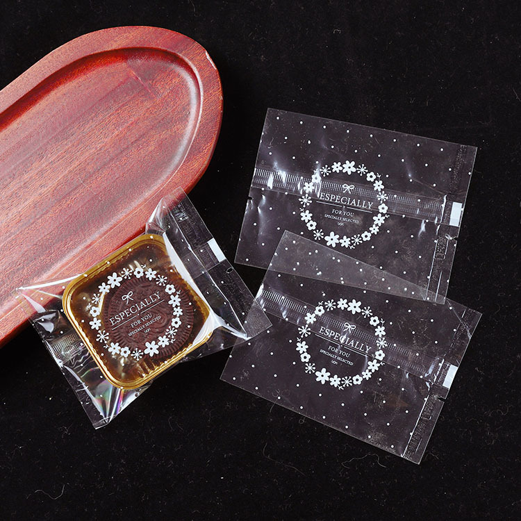 Directo de fábrica transparente pequeño jardín mooncake bolsa pequeña fresca 50g yema de huevo bolsa de embalaje crujiente bolsa de galletas en stock