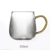 Yellow handle cup with vertical stripes