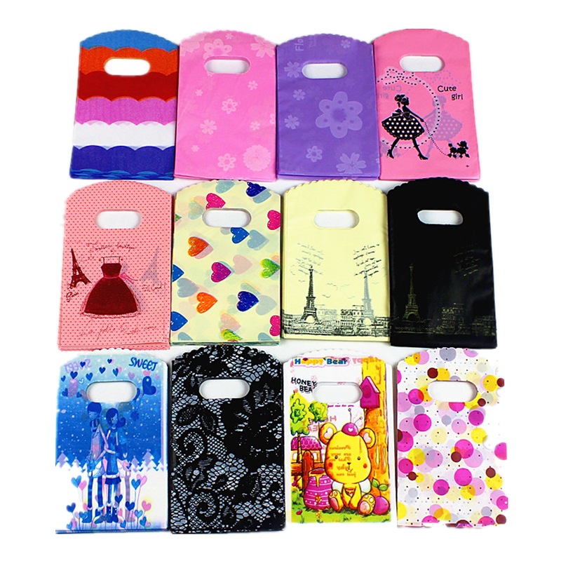 Spot boutique de moda embalaje de regalo ropa bolso de mano compras de plástico al por mayor 100 pc/paquete de impresión LOGO