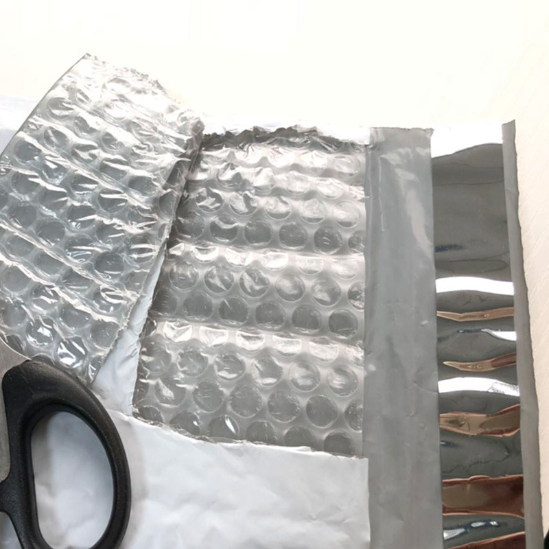 En stock bolsa de burbuja de película coextruida engrosada ropa impermeable bolsa de embalaje expreso bolsa de espuma de película de burbuja compuesta al por mayor