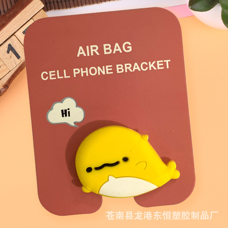 En stock al por mayor TikTok Cartoon creativo soporte de teléfono móvil puede soportar airbag soporte de teléfono móvil soporte de escritorio