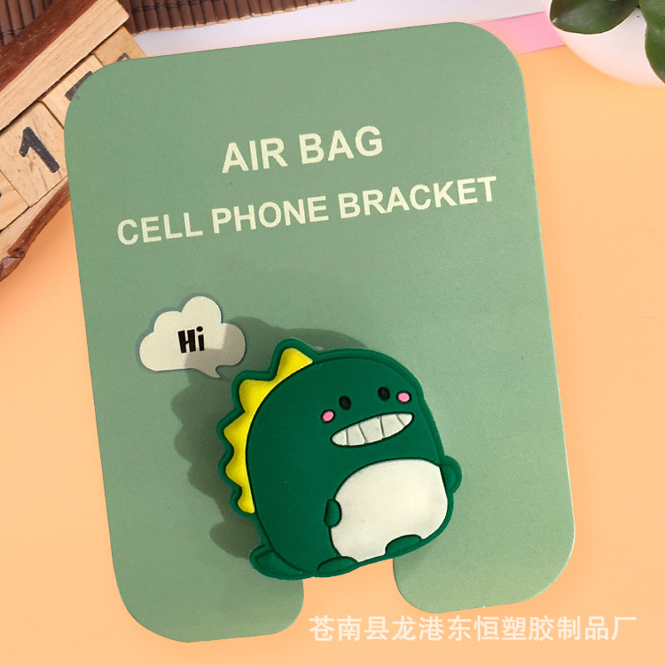 En stock al por mayor TikTok Cartoon creativo soporte de teléfono móvil puede soportar airbag soporte de teléfono móvil soporte de escritorio