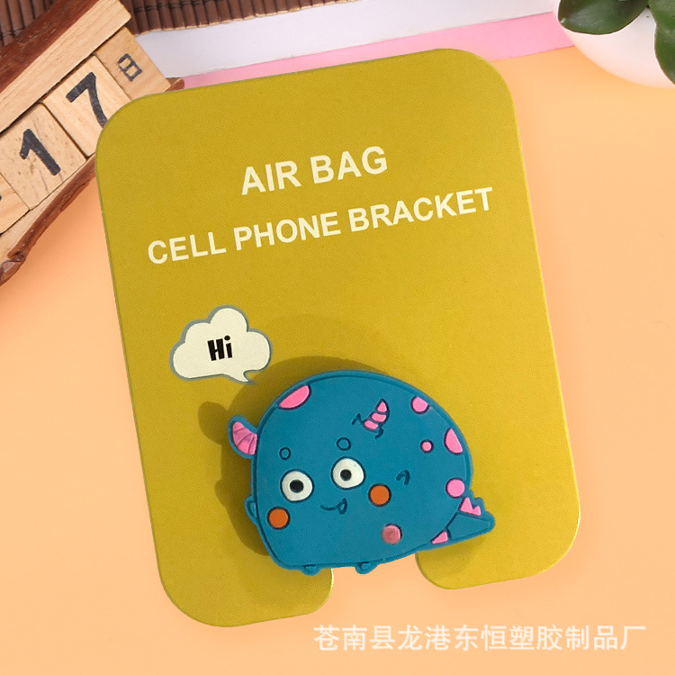 En stock al por mayor TikTok Cartoon creativo soporte de teléfono móvil puede soportar airbag soporte de teléfono móvil soporte de escritorio