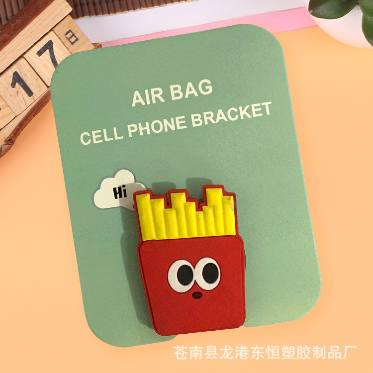 En stock al por mayor TikTok Cartoon creativo soporte de teléfono móvil puede soportar airbag soporte de teléfono móvil soporte de escritorio
