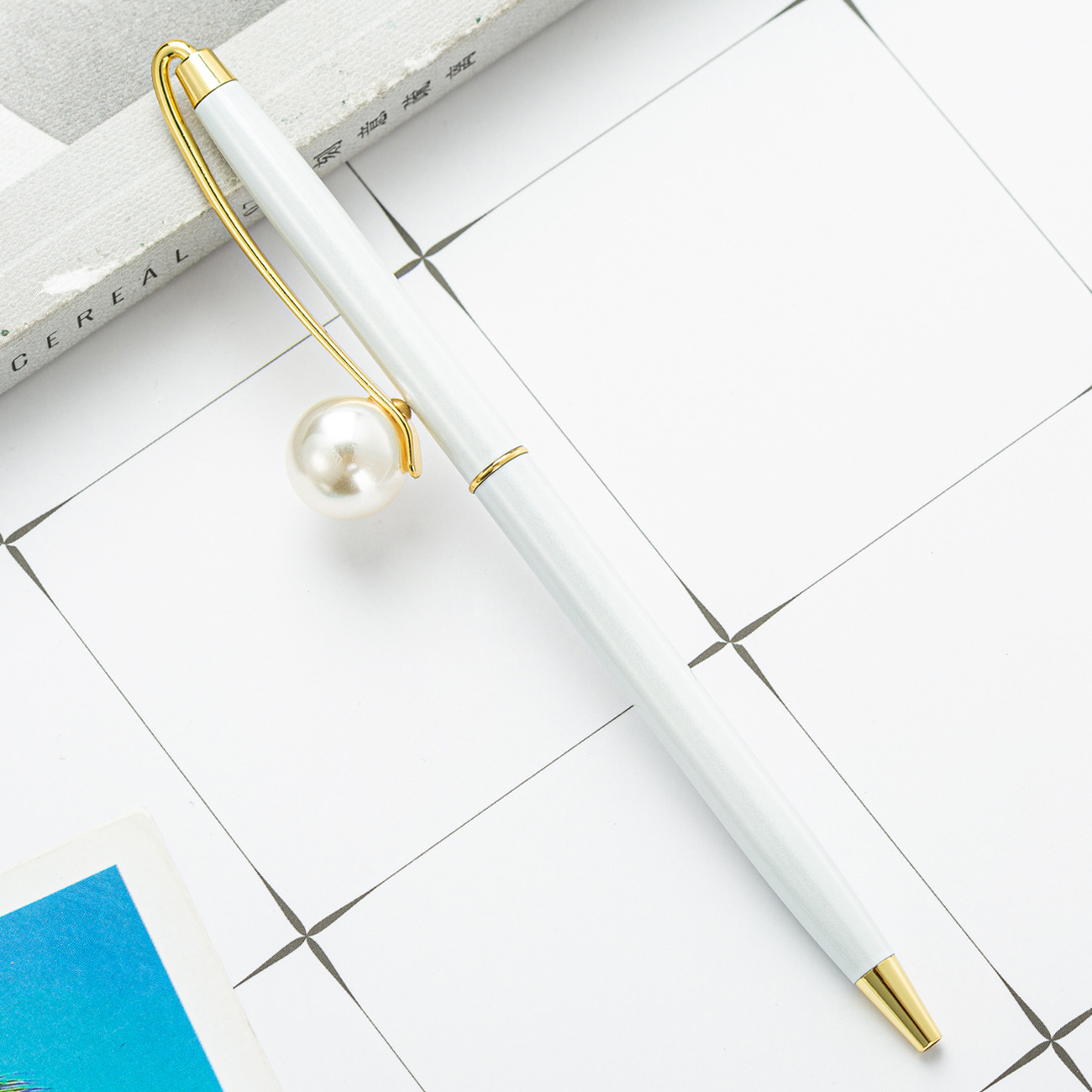 Fábrica en stock nuevo bolígrafo de metal perla pequeña pluma de regalo fresco pluma de publicidad al por mayor impresión de logotipo