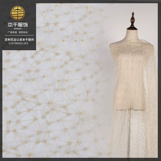 银线花边婚纱面料 洛丽塔服饰面料金色花边网格乱网纱现货