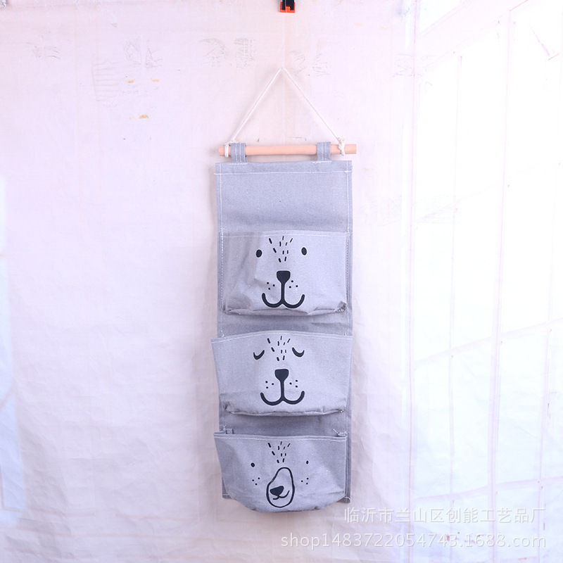 Expresión de dibujos animados de algodón y lino Bolsa colgante de almacenamiento de una pieza de tres bolsillos Bolsa colgante de almacenamiento de semicírculo Bolsa colgante decorativa Bolsa colgante