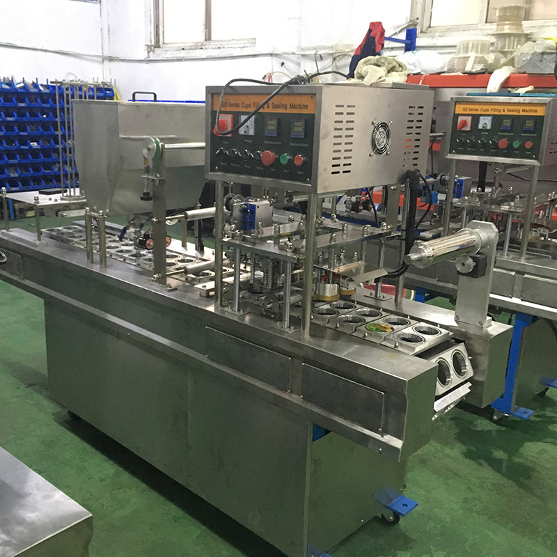 一出二机械式灌装封口机  羊肉卷盒装封口机  餐盒包装封口机