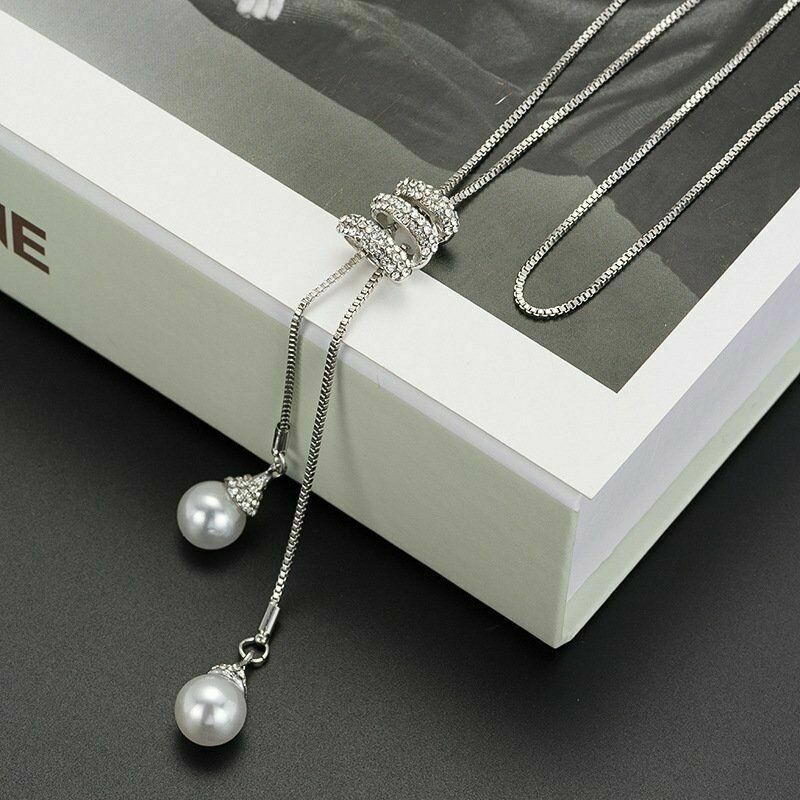 Nuevo estilo largo simple perla espiral colgante largo COLLAR COLGANTE todo-fósforo diamante borla suéter cadena para las mujeres al por mayor image 4