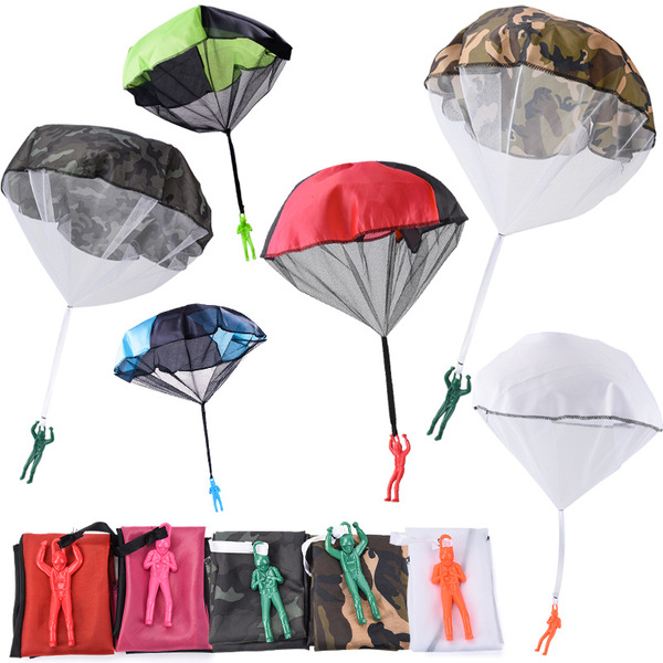 Spot children hand tossing parachutes