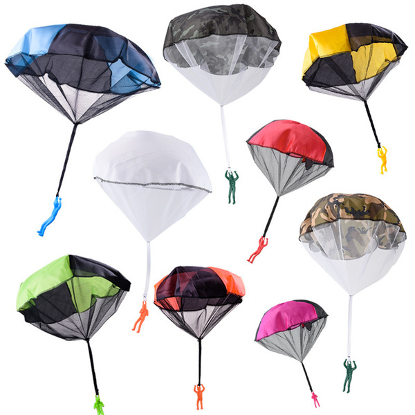 Spot children hand tossing parachutes