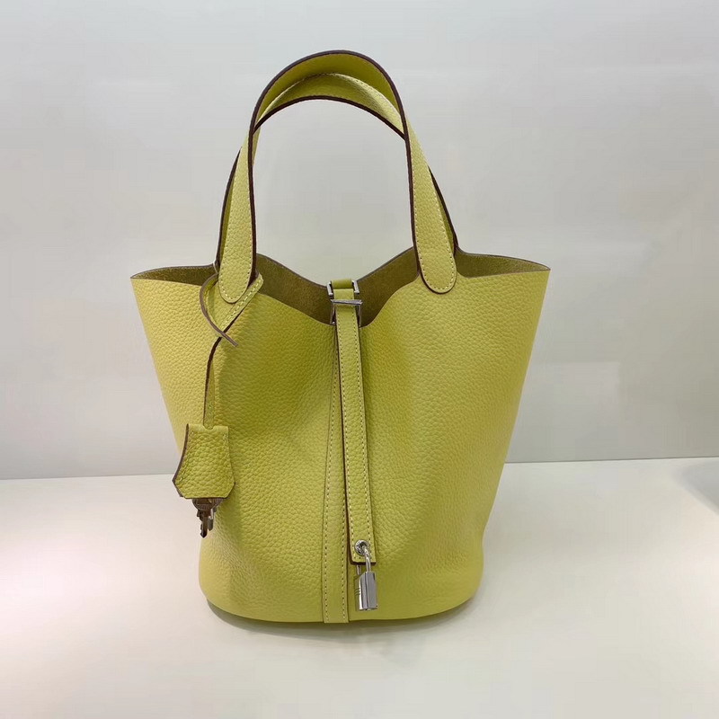 El nuevo bolso de cesta de verduras de marea de cuero togo de piel de vaca de capa superior 2025, bolso de cubo con cerradura de mano, bolso de cuero para mujer