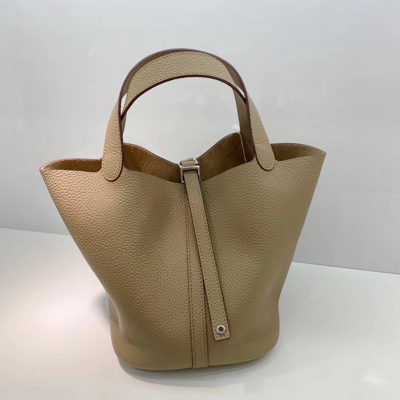 El nuevo bolso de cesta de verduras de marea de cuero togo de piel de vaca de capa superior 2025, bolso de cubo con cerradura de mano, bolso de cuero para mujer