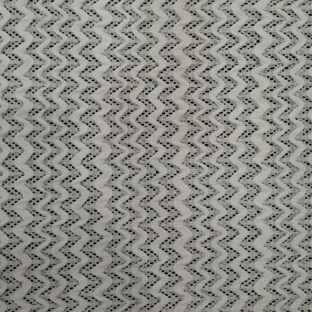 处理特价针织面料涤氨提花网布粗针经编女装童装布料【欢迎议价】