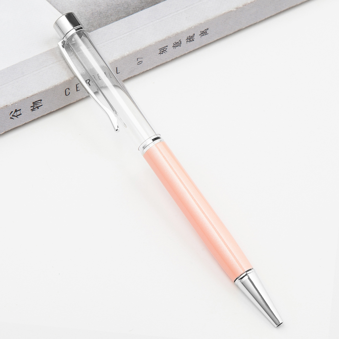 Fábrica al por mayor de metal creativo bolígrafo DIY impresión pluma de cristal japonés y coreano llenado de aceite tubo vacío bolígrafo