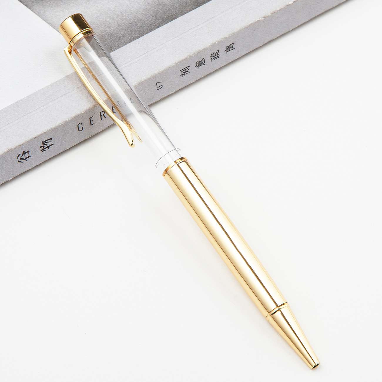 Fábrica al por mayor de metal creativo bolígrafo DIY impresión pluma de cristal japonés y coreano llenado de aceite tubo vacío bolígrafo