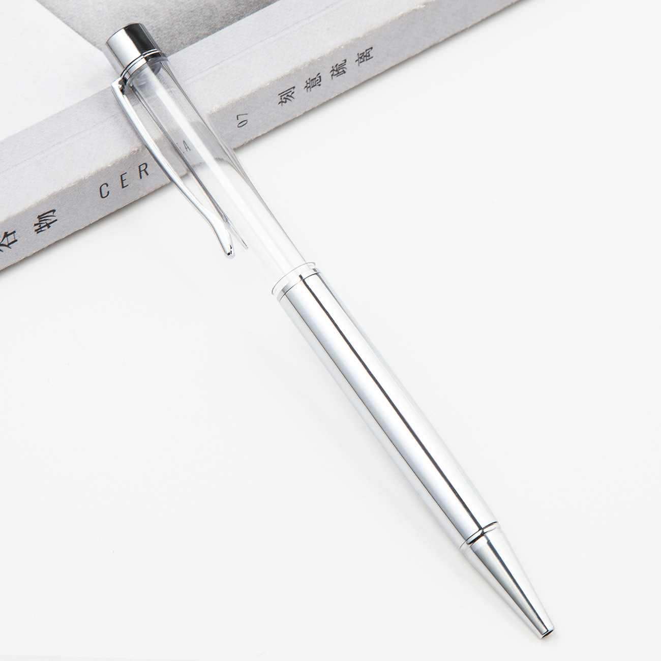 Fábrica al por mayor de metal creativo bolígrafo DIY impresión pluma de cristal japonés y coreano llenado de aceite tubo vacío bolígrafo