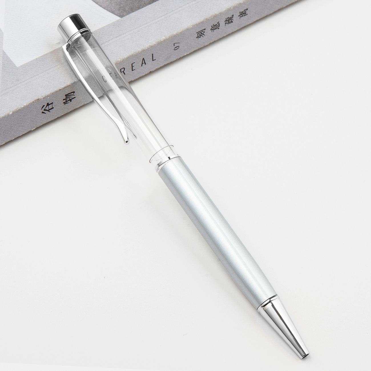 Fábrica al por mayor de metal creativo bolígrafo DIY impresión pluma de cristal japonés y coreano llenado de aceite tubo vacío bolígrafo