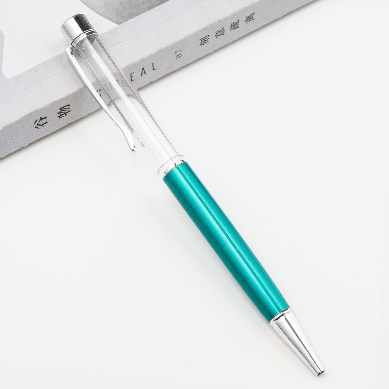 Fábrica al por mayor de metal creativo bolígrafo DIY impresión pluma de cristal japonés y coreano llenado de aceite tubo vacío bolígrafo
