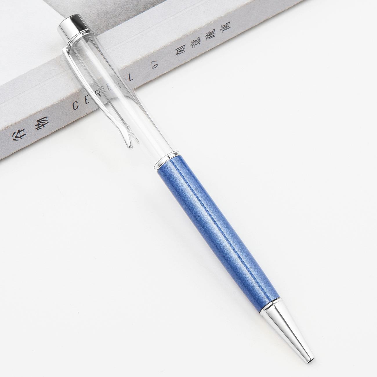 Fábrica al por mayor de metal creativo bolígrafo DIY impresión pluma de cristal japonés y coreano llenado de aceite tubo vacío bolígrafo