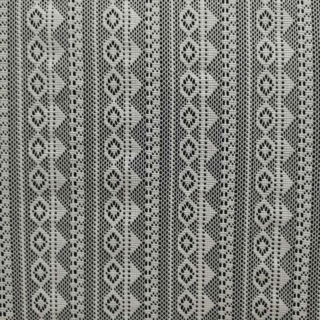 特价爆款针织面料涤纶提花网布粗针经编女装童装布料【欢迎议价】