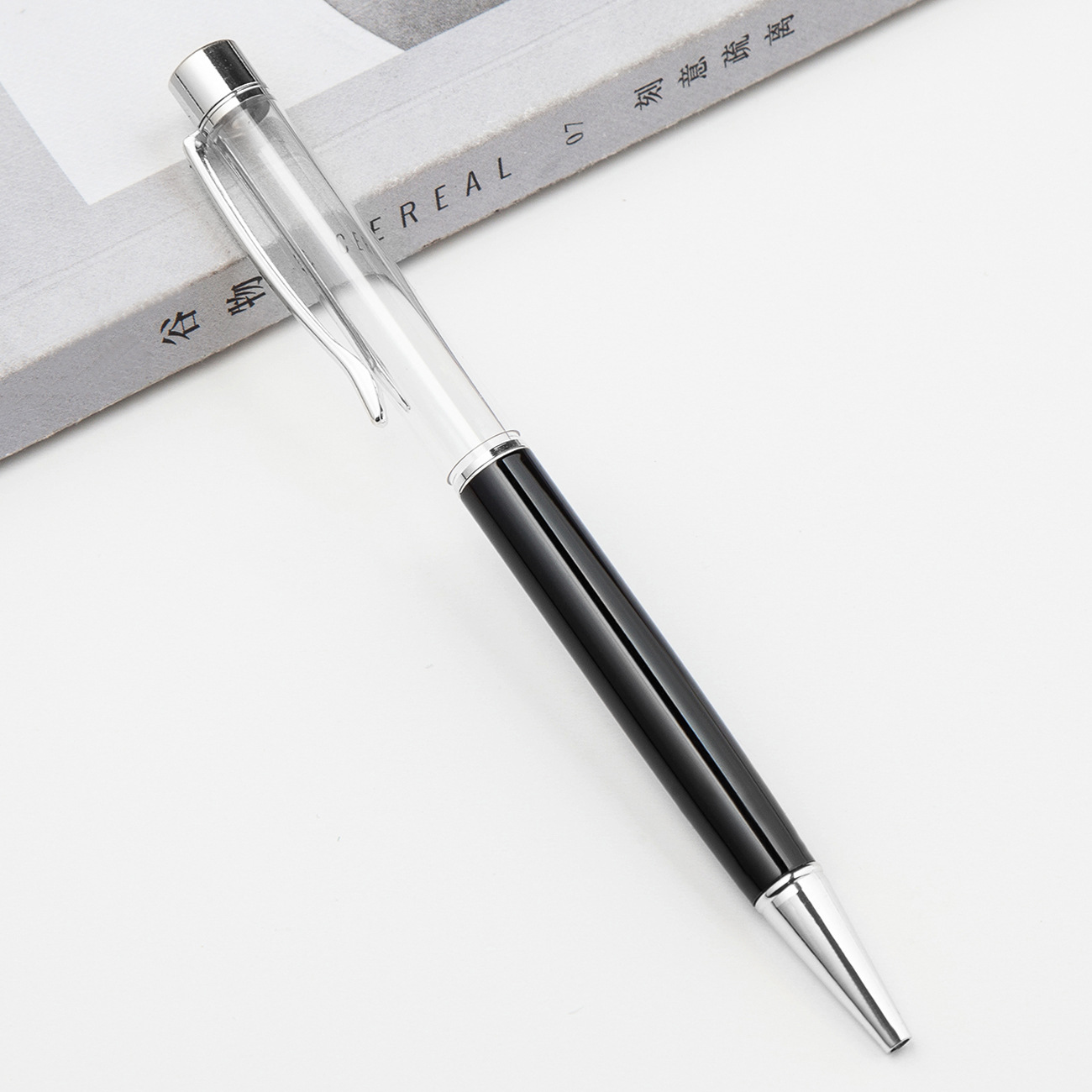 Fábrica al por mayor de metal creativo bolígrafo DIY impresión pluma de cristal japonés y coreano llenado de aceite tubo vacío bolígrafo